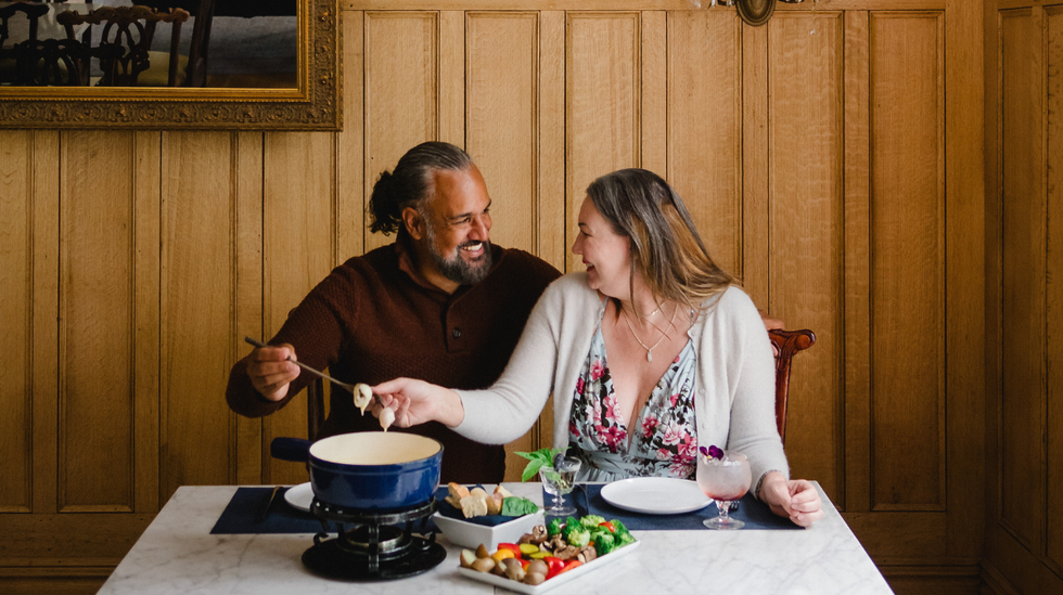 Two diners enjoying fondue during Kingstonlicious.