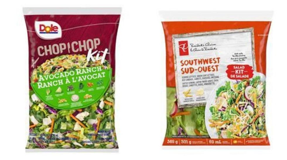 Two packages of salad kits.