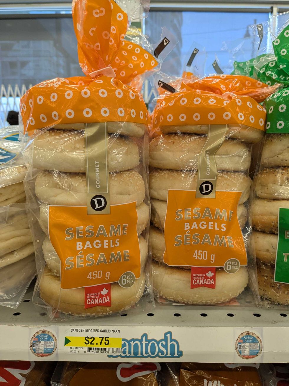 Two packages of sesame bagels on the shelf at Dollarama