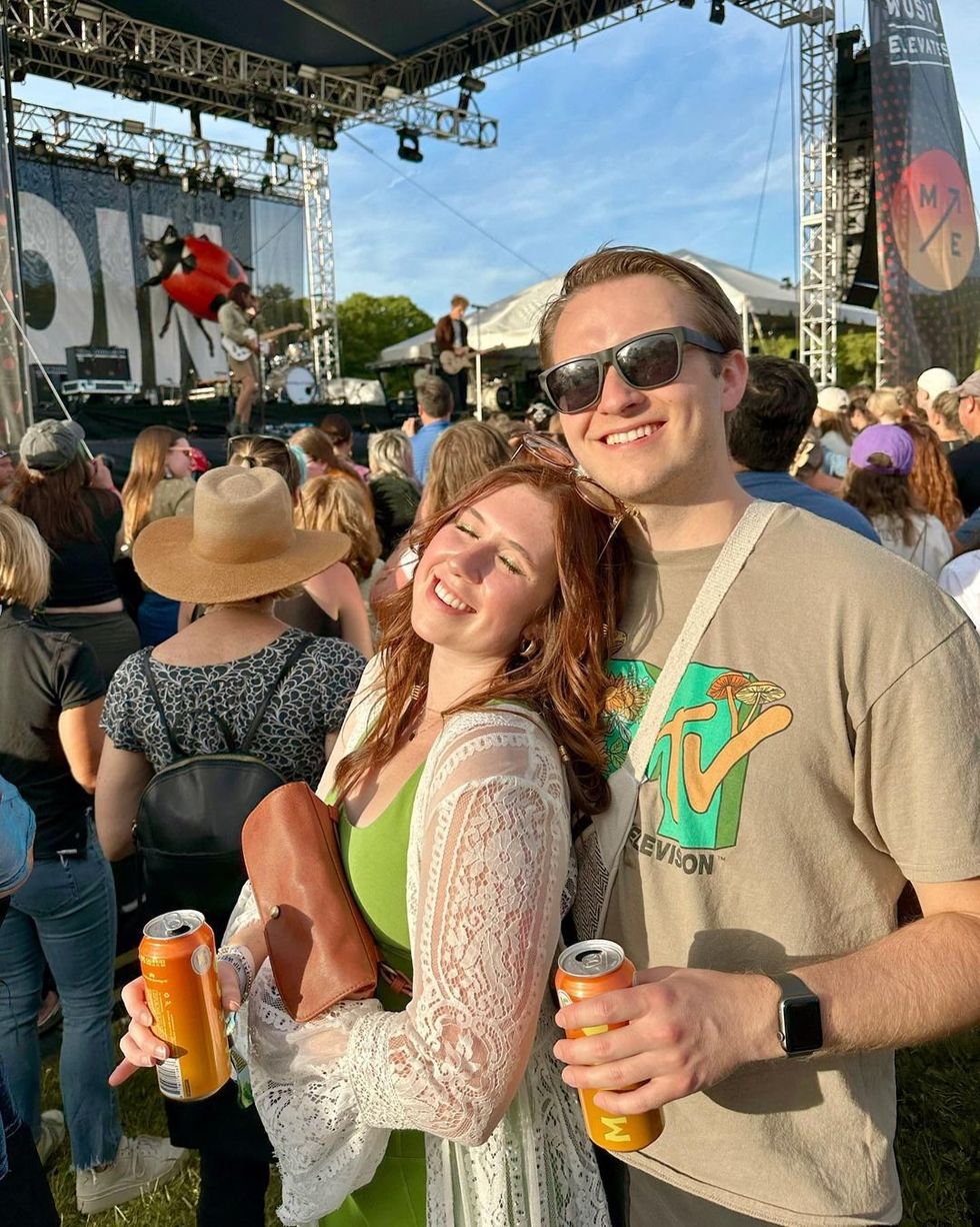 Two people enjoying a music festival at Hartwood Acres Park.