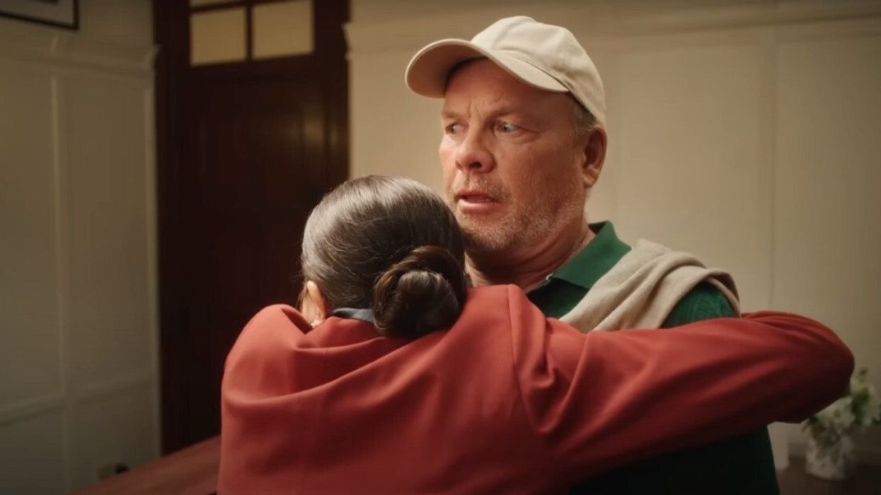 Two people hugging.
