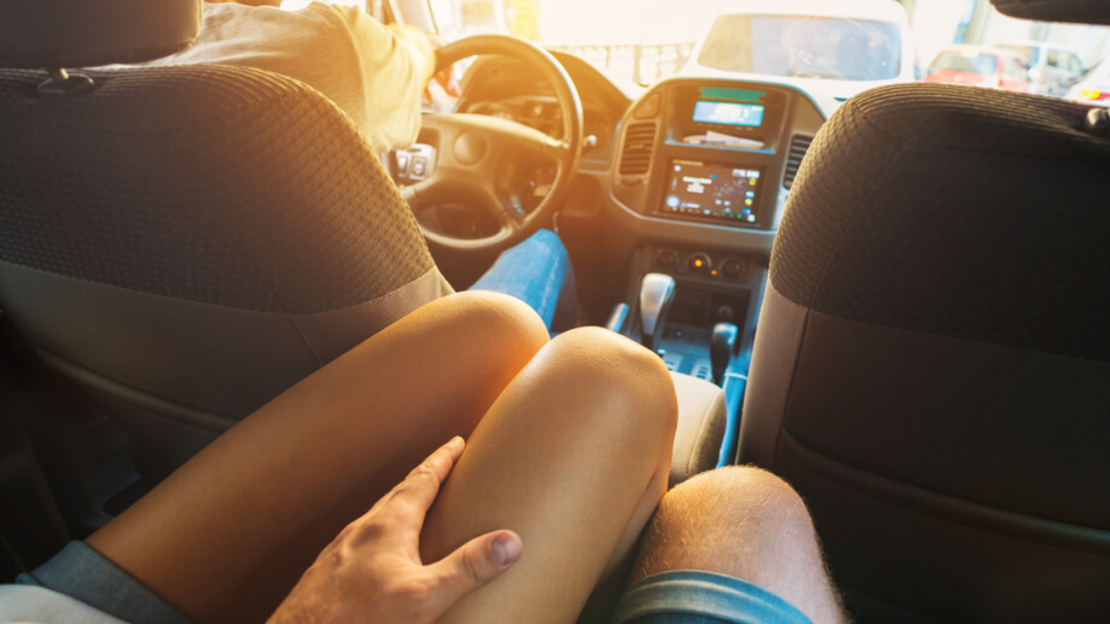 Two people in the back of a car.