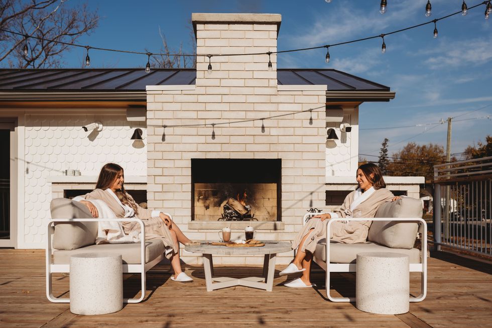 Two people on the rooftop patio.