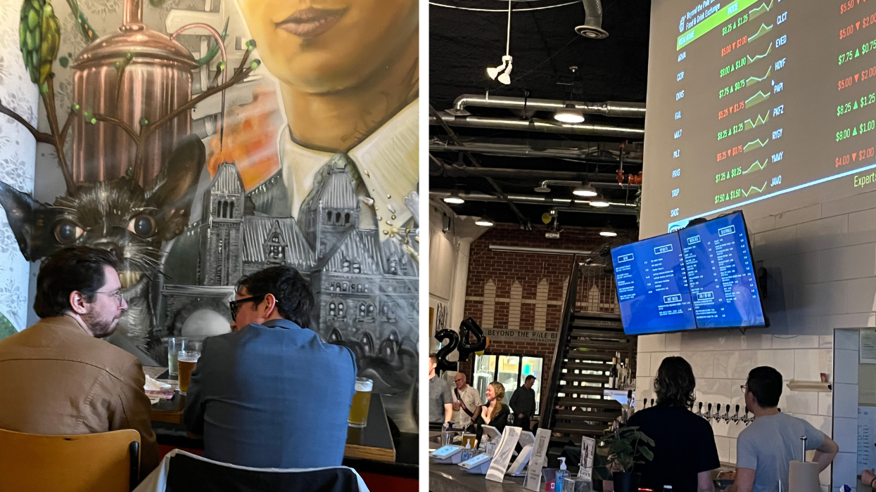 Two people sit with beers in front of an art mural. Right. A stock market ticker board projected on the wall of a bar.