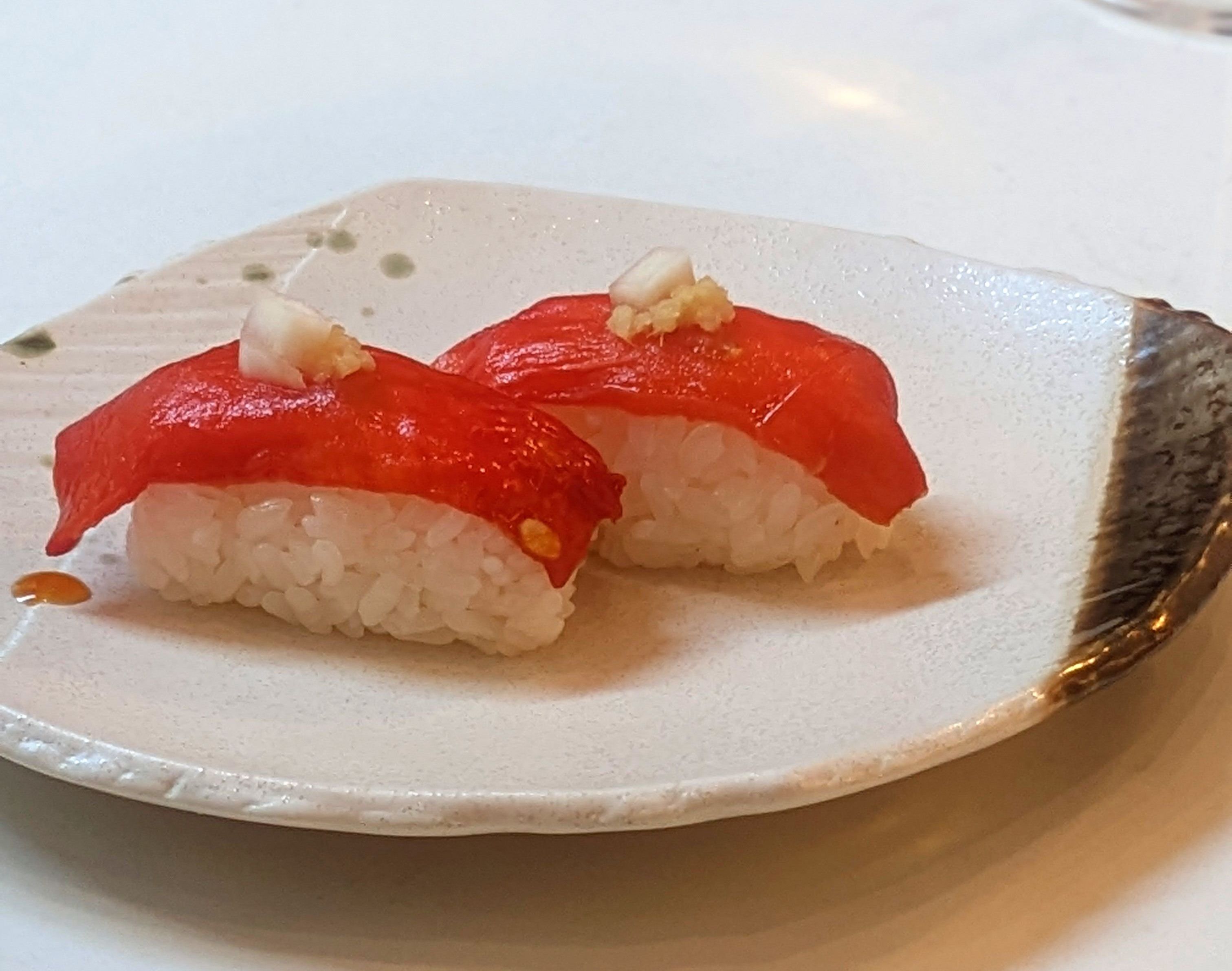 Two pieces of ahi watermelon nigiri from Planta.