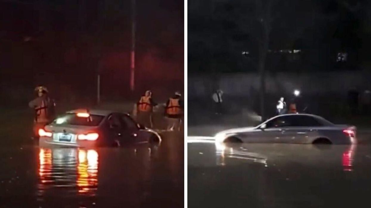 Two vehicles caught in deep water due to a watermain break in Mississauga, Ontario.