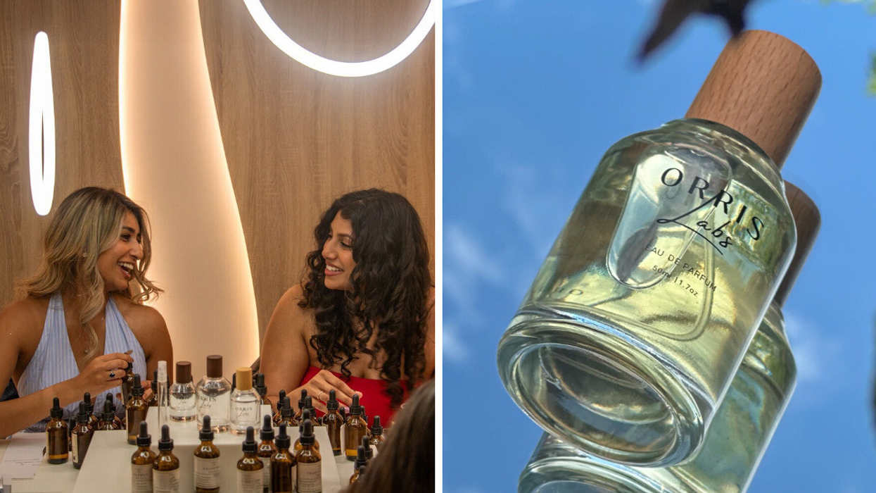 Two women smiling and creating custom perfumes at a fragrance workshop surrounded by bottles of essential oils., Right: Close-up of an Orris Labs Eau de Parfum bottle with a wooden cap against a blue sky background.