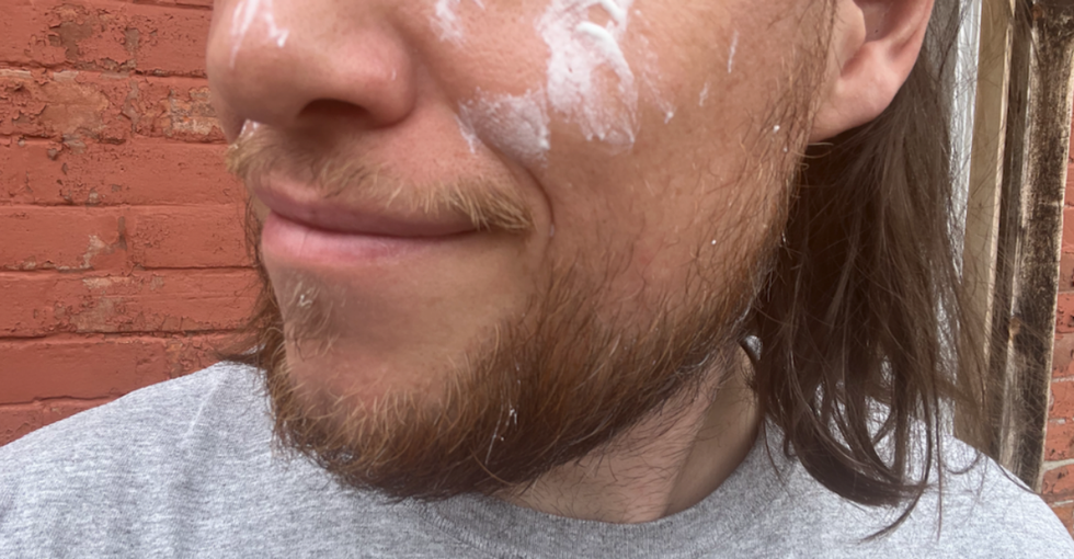 \u200bA man with sunscreen unevenly spread across his face.