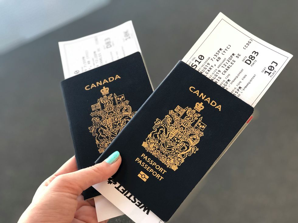 \u200bA person holds Canadian passports.