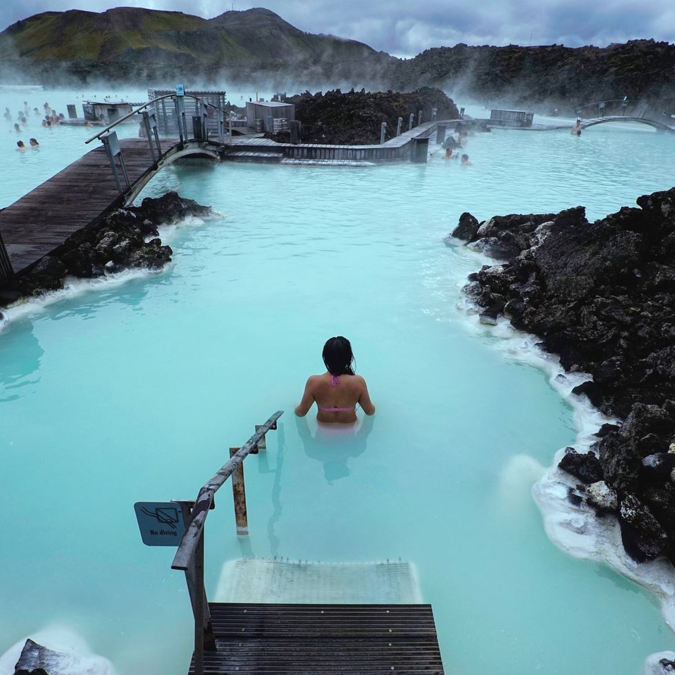\u200bA person soaks in the Blue Lagoon in Iceland.