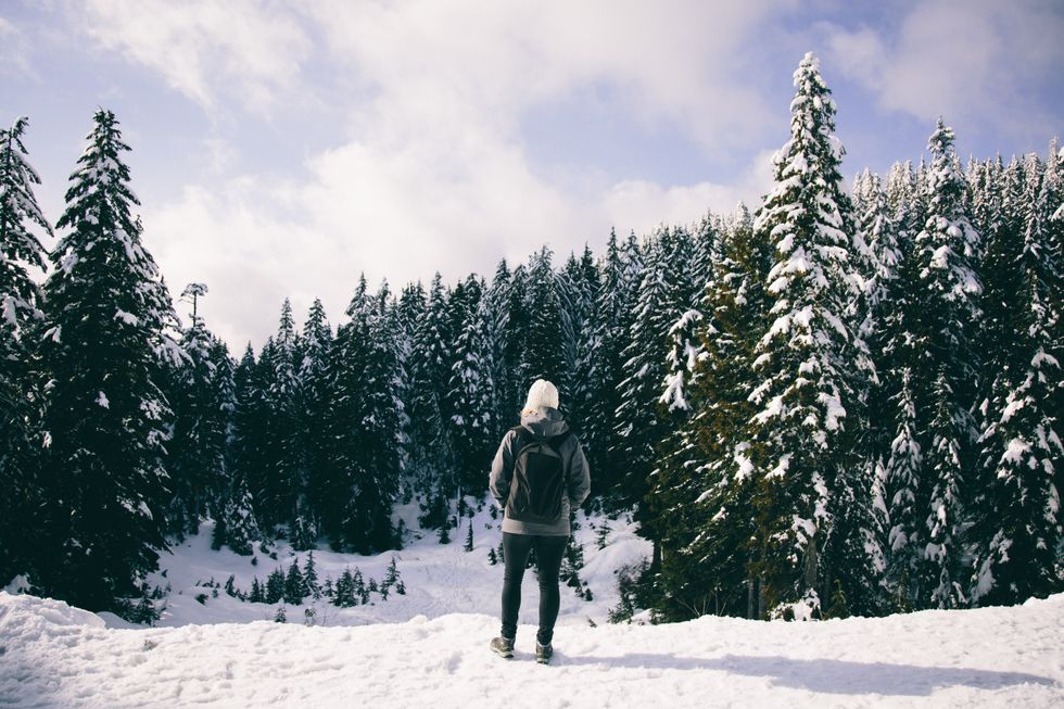 \u200bA person stands in snow in Mount Seymour, B.C.
