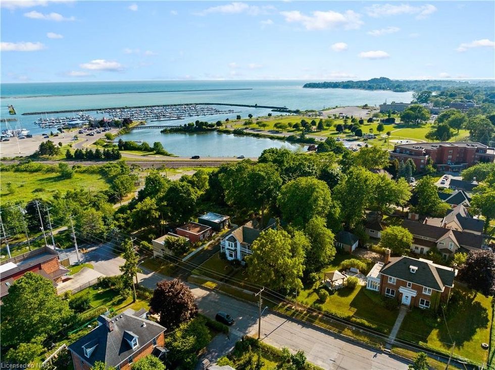 \u200bA street by a lake.