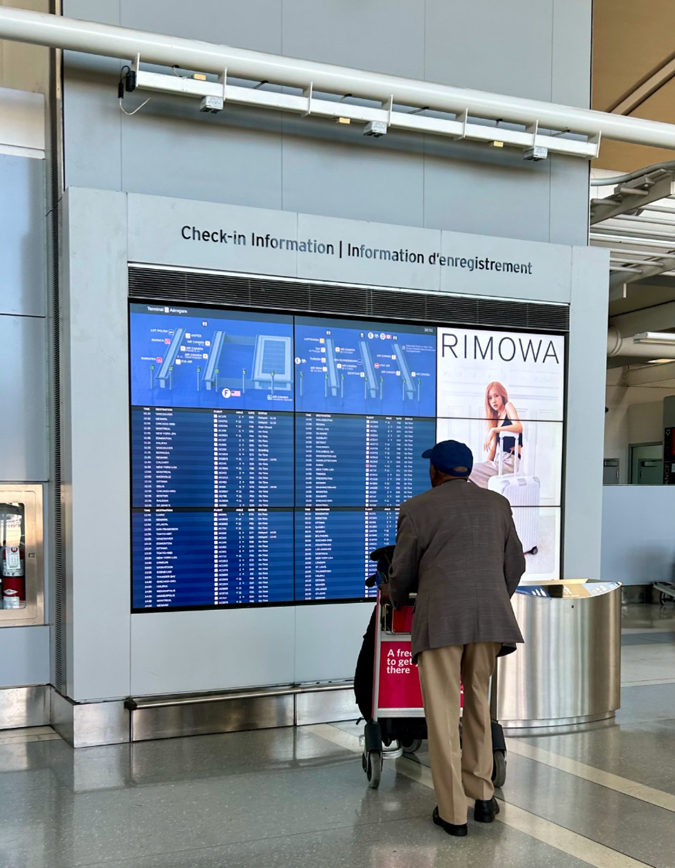 \u200bA wait times dashboard at the airport.