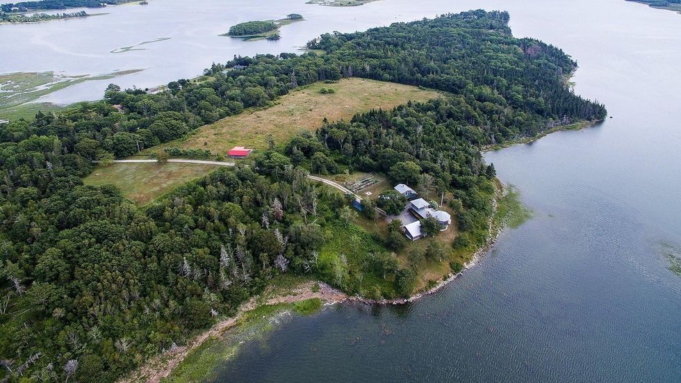 \u200bAerial view of the house for sale and its 15 acres of land.