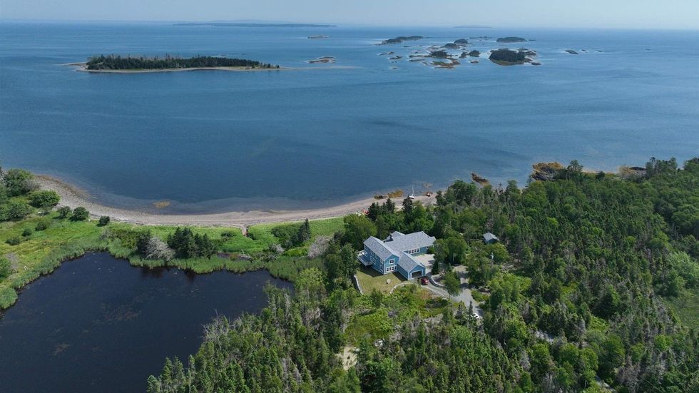 \u200bAerial view of the waterfront house for sale in Nova Scotia.