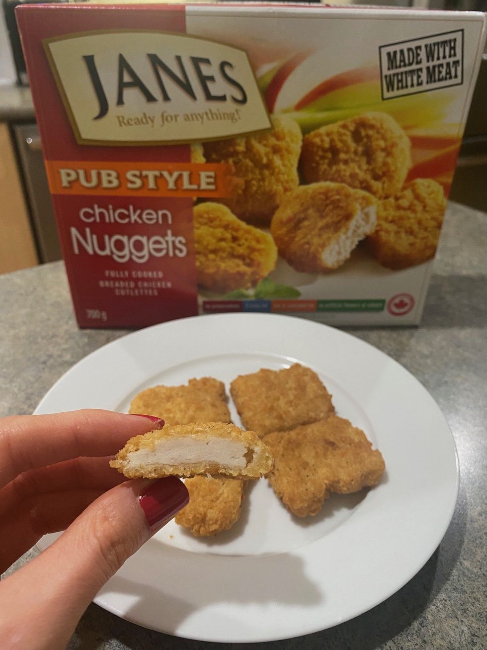 \u200bAsymina holding a Janes chicken nugget.