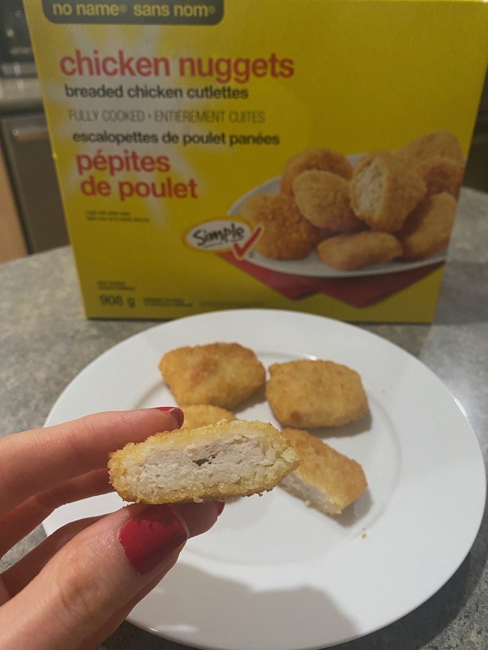 \u200bAsymina holding a No Name chicken nugget.