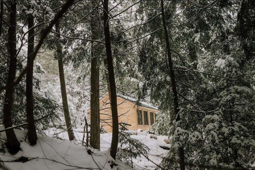 \u200bCabin in a snowy forest.