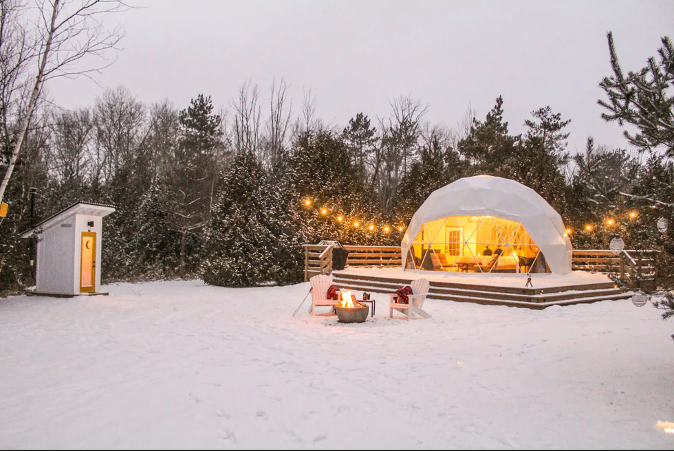 \u200bDome with twinkling lights in the snow.
