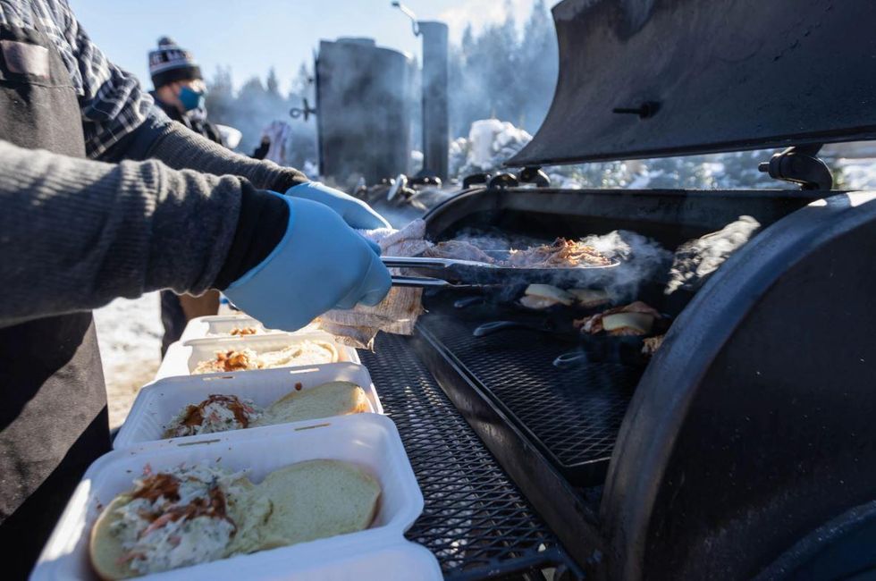\u200bFood being cooked outdoors in the winter.