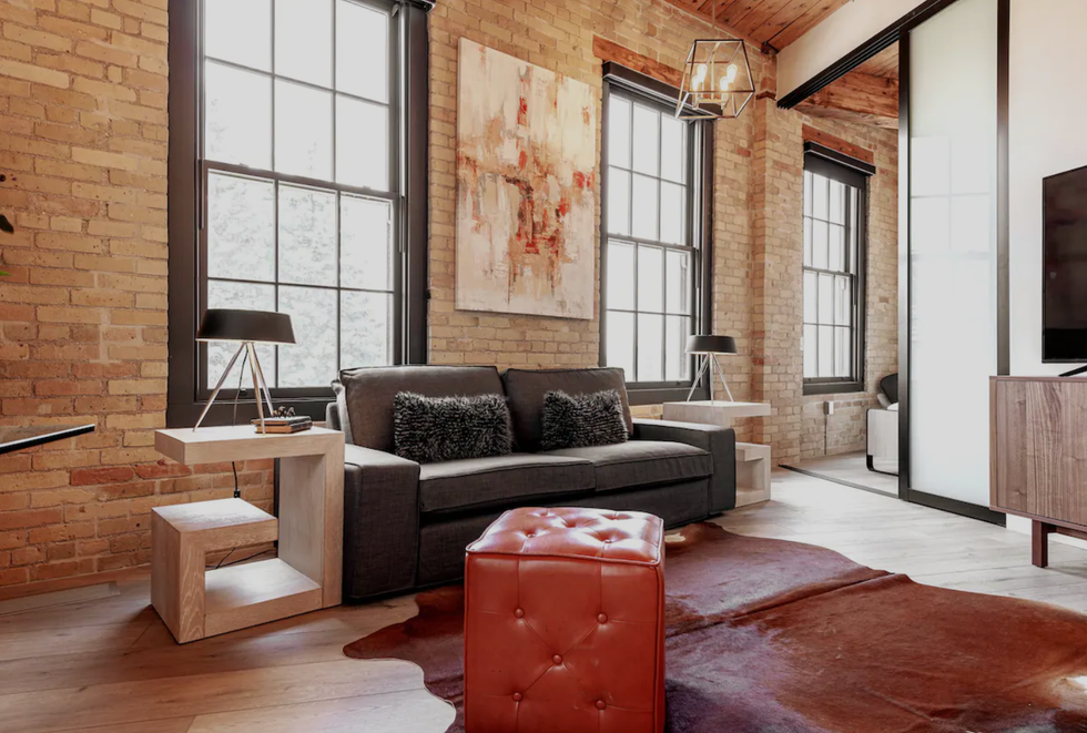 \u200bLoft with exposed brick walls.