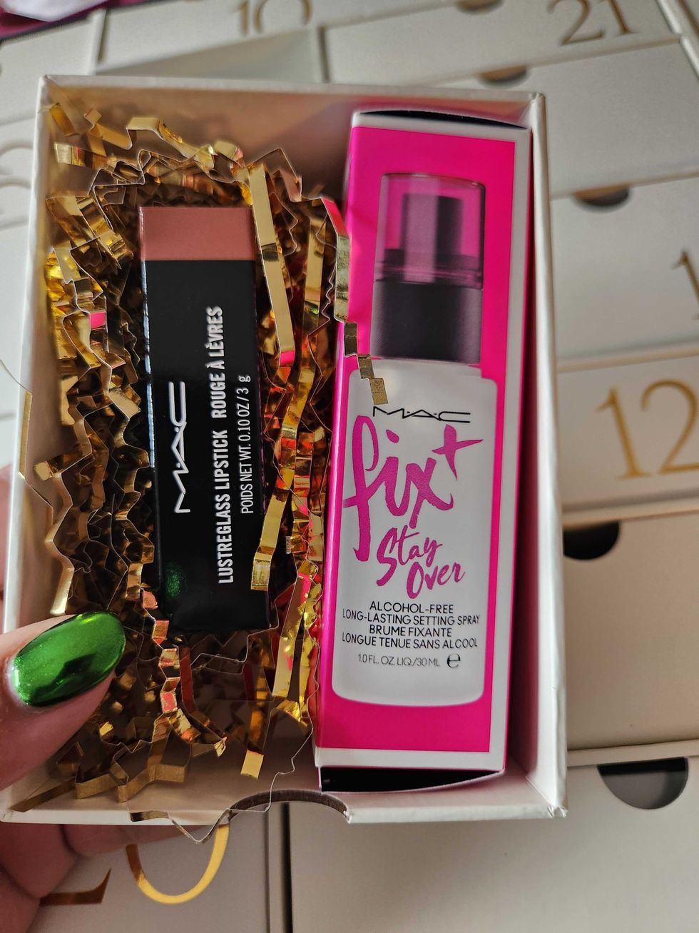 \u200bM.A.C. Lustreglass Lipstick in Hug Me and M.A.C. Fix + Stay.