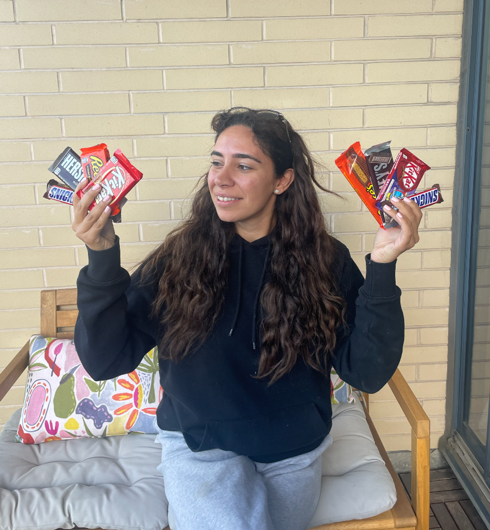 \u200bMira holding chocolates.