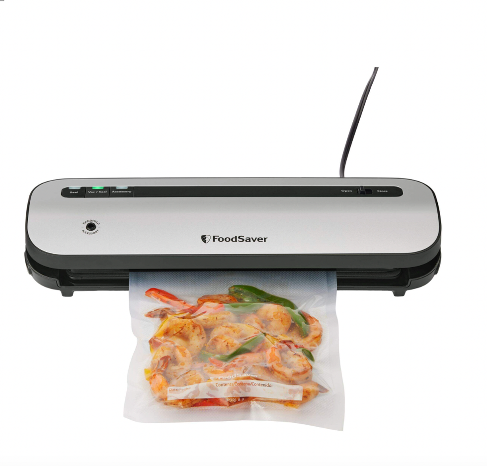 \u200bScelleuse sous vide compacte FoodSaver VS1230 avec sacs et rouleau en acier inoxydable.