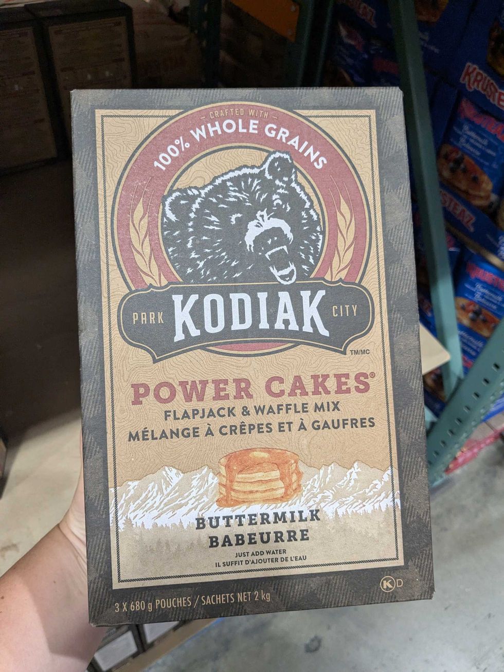 \u200bSomeone holding a box of Kodiak protein pancakes