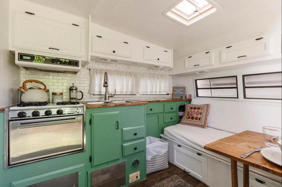 \u200bThe kitchen and breakfast nook at the Glamper Camper Airbnb.