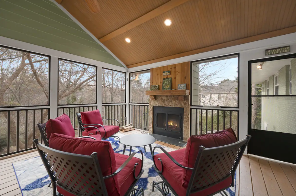 \u200bThe screened-in porch at the waterfront home.