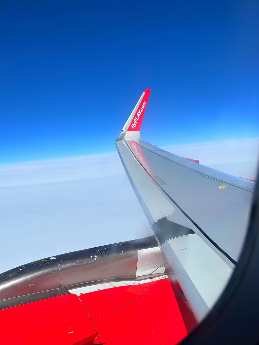 \u200bThe wing of a Play Airlines flight.