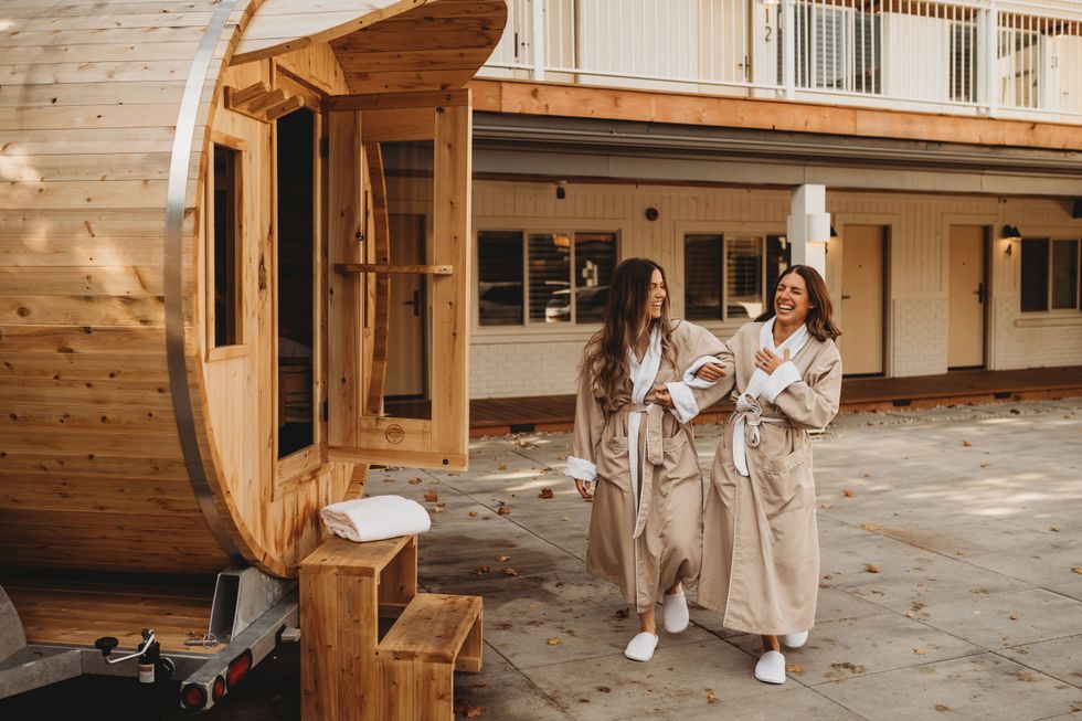 \u200bTwo people by a sauna.