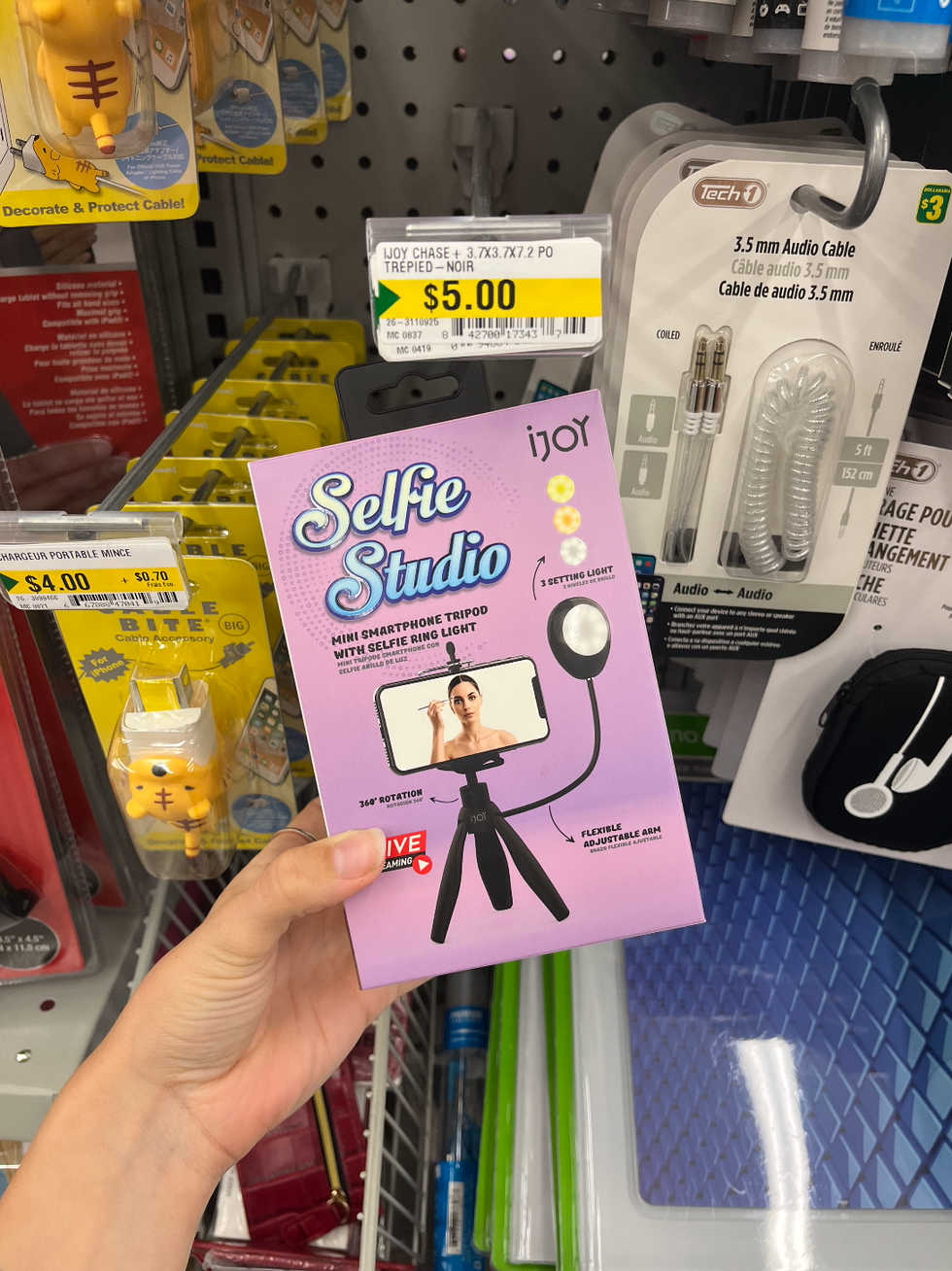 Un mini tr\u00e9pied \u00e0 cellulaire avec lumi\u00e8re.