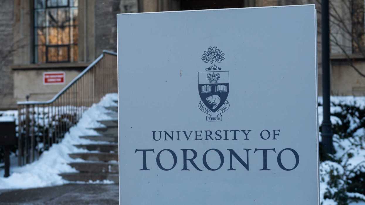 university of toronto sign in front of snow covered stairs