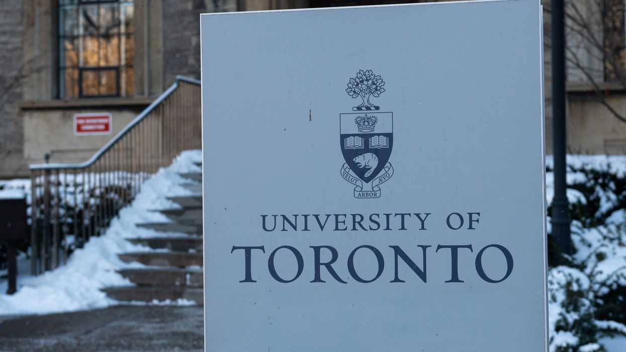 university of toronto sign in front of snow-covered steps