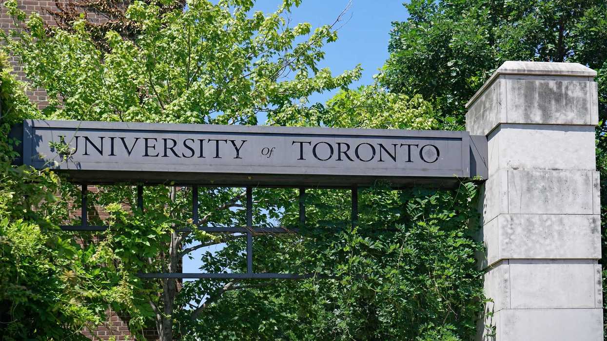 university of toronto sign in front of trees on campus