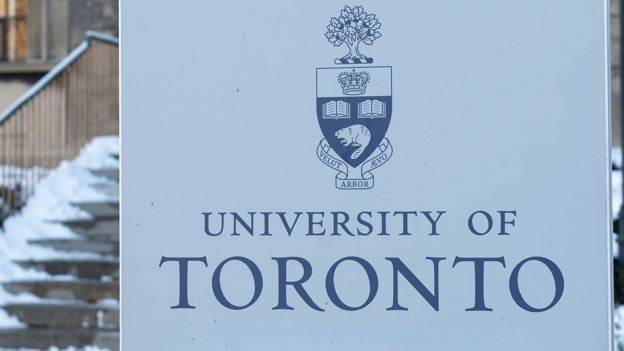university of toronto sign on campus in front of snow covered steps