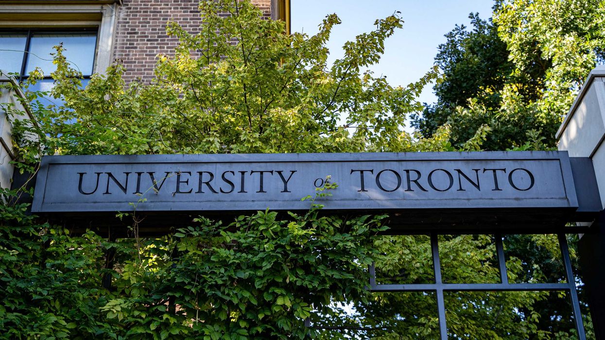 university of toronto sign surrounded by trees
