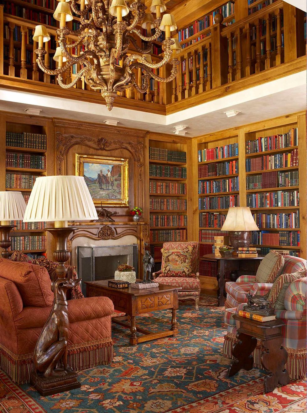 Various cushioned seats are available in the library, which is decorated with floor-to-ceiling bookcases and wood engravings and sculptures.