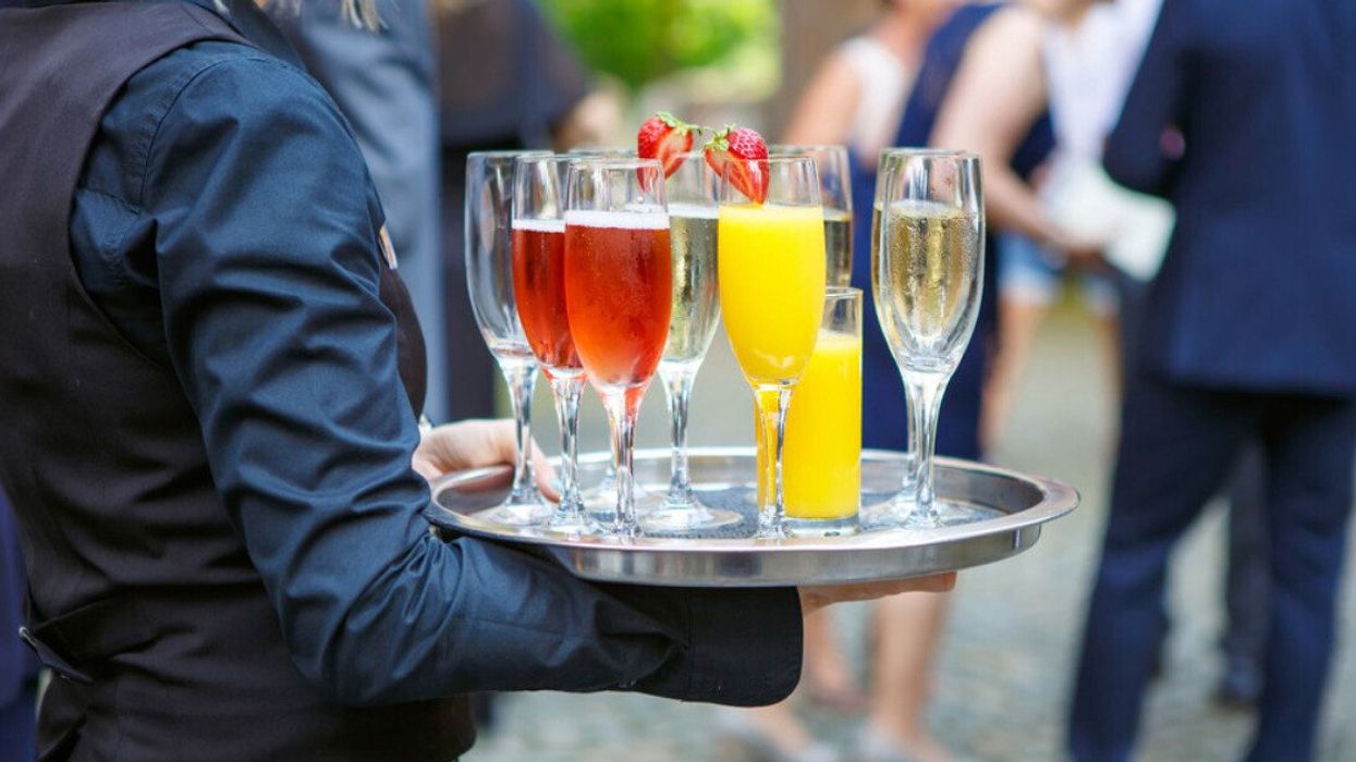 Various drinks are served to wedding guests.