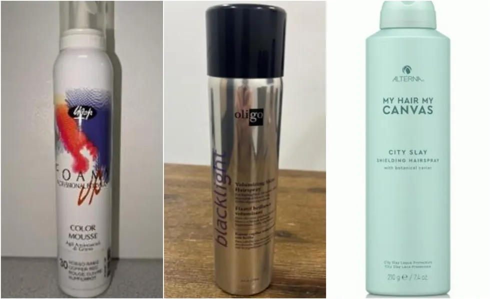 Various haircare products including two hairspray bottles and a mousse item.