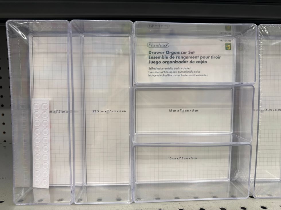 Various-sized clear plastic containers with a label that says drawer organizer set.