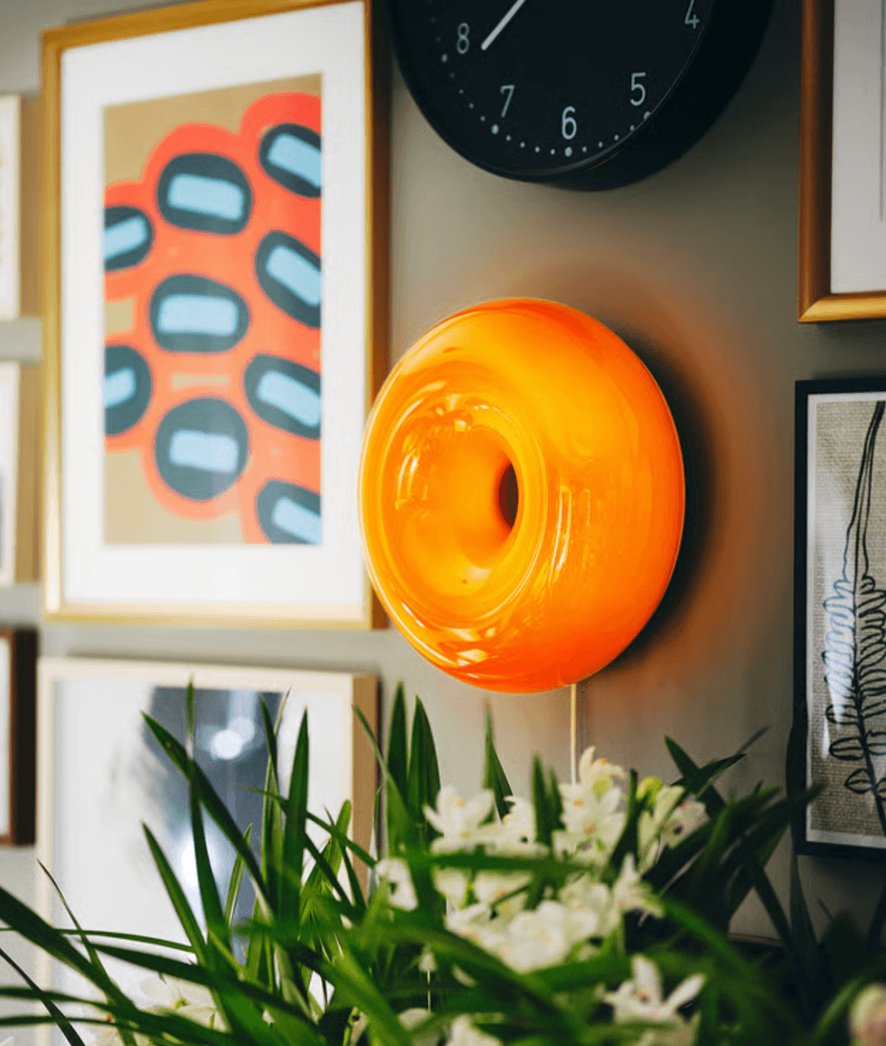 VARMBLIXTLED table/wall lamp positioned on a wall.
