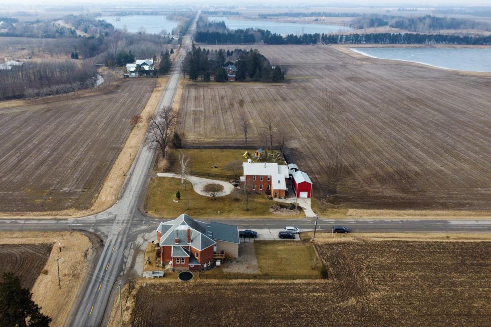 Vast farmland and country views of massive Ontario house.