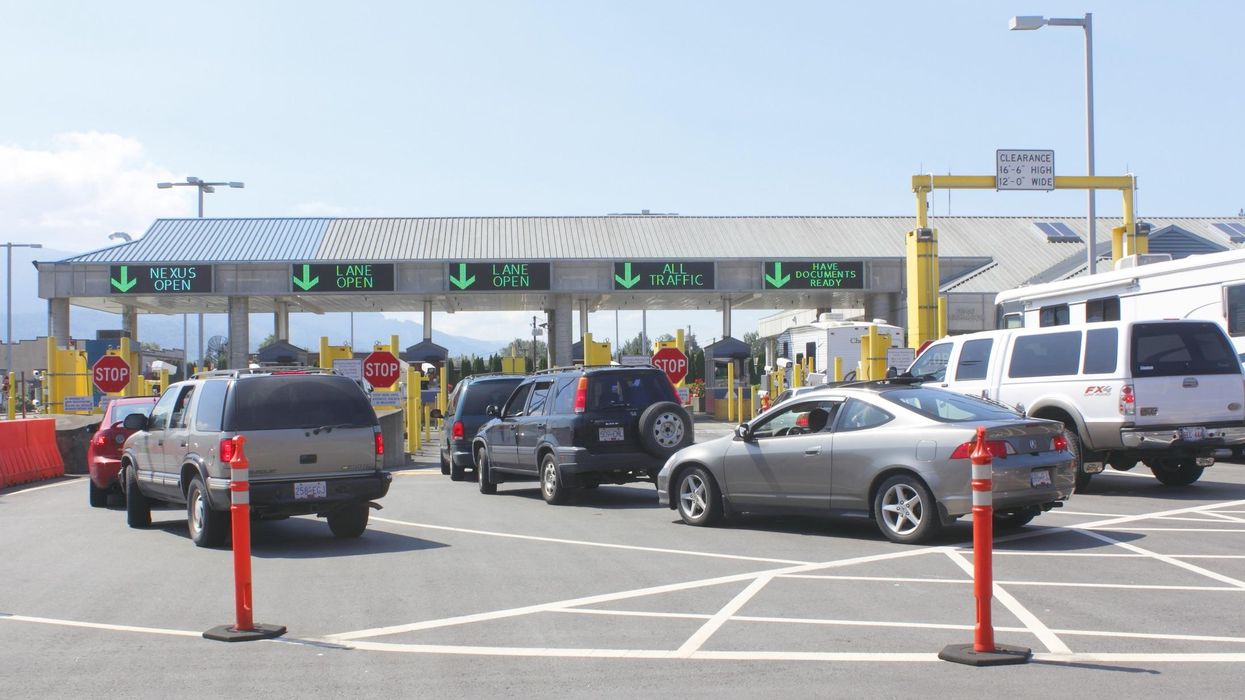 Vehicles at a border crossing.