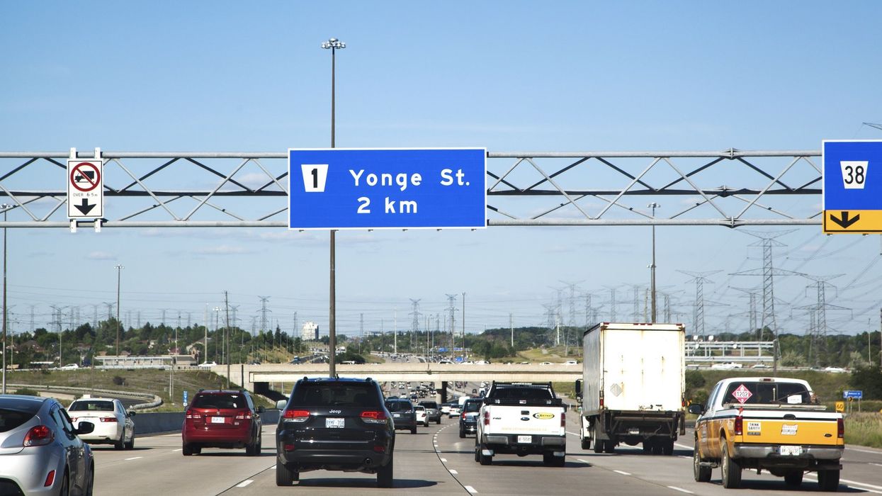 Vehicles driving on Highway 7 in Toronto, Ontario.