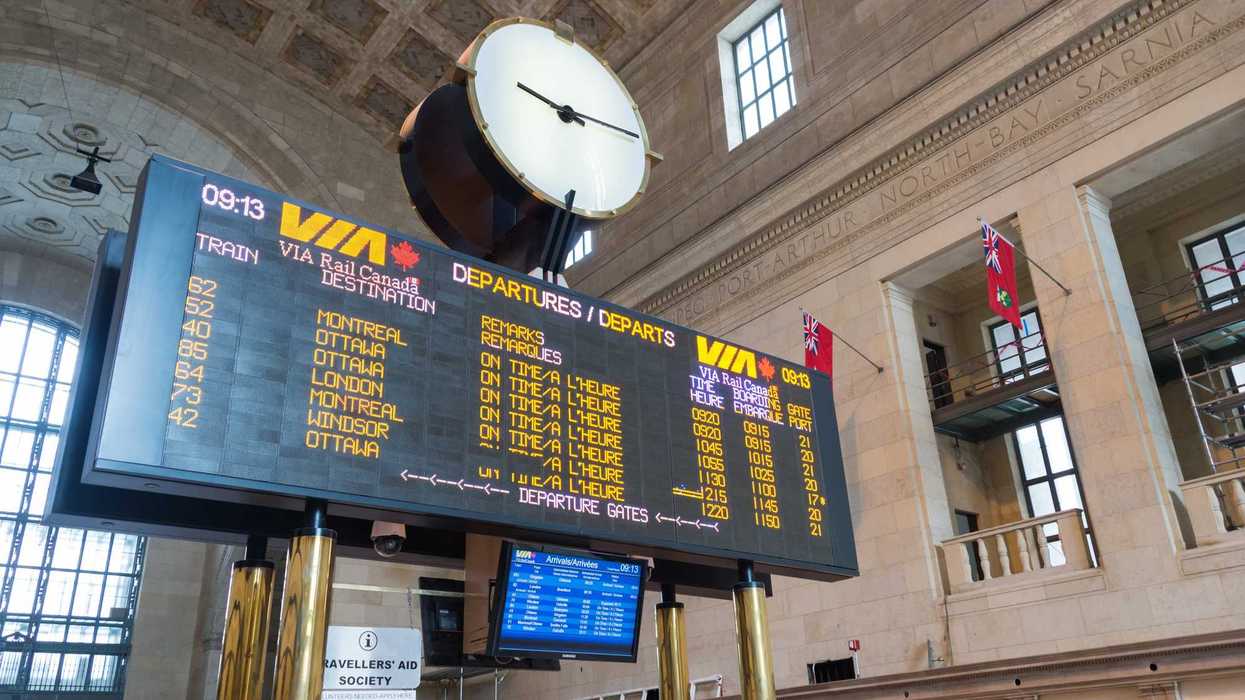 via rail departures board inside toronto union station