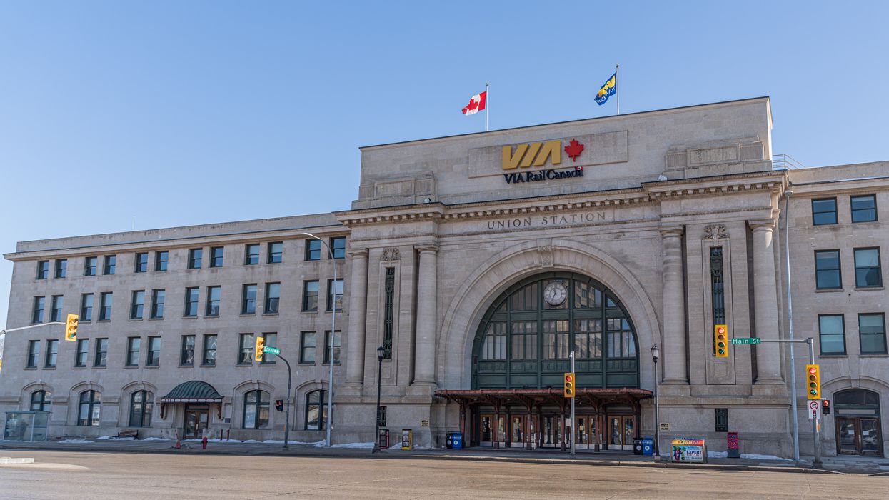 via rail sign on exterior of a train station in winnipeg