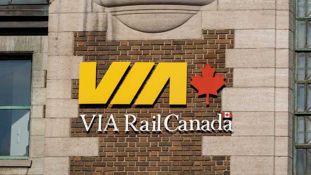 via rail sign on exterior of train station